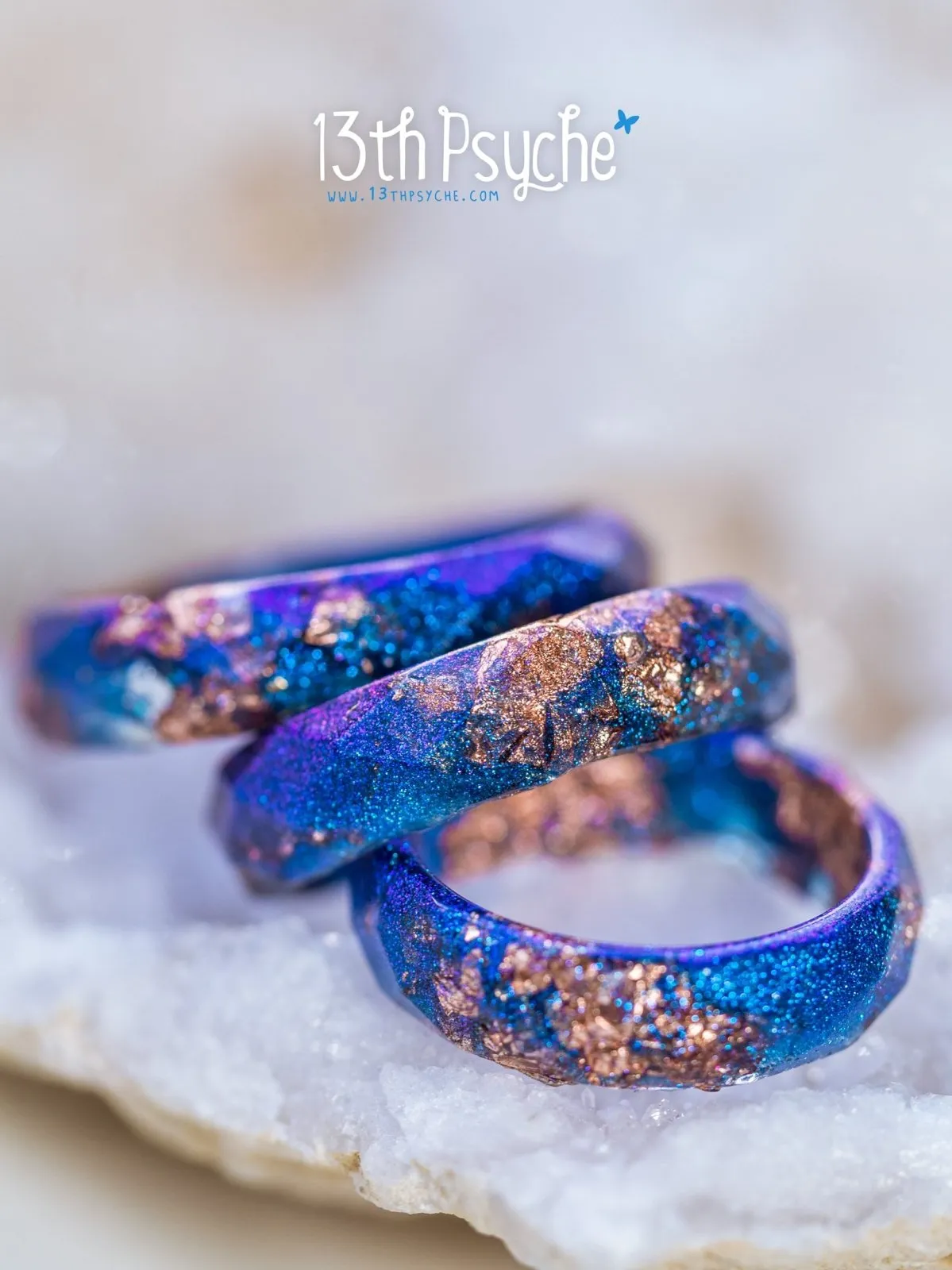 Iridescent blue faceted resin ring with rose gold flakes