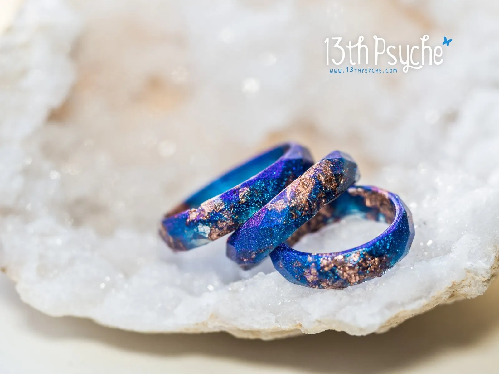 Iridescent blue faceted resin ring with rose gold flakes